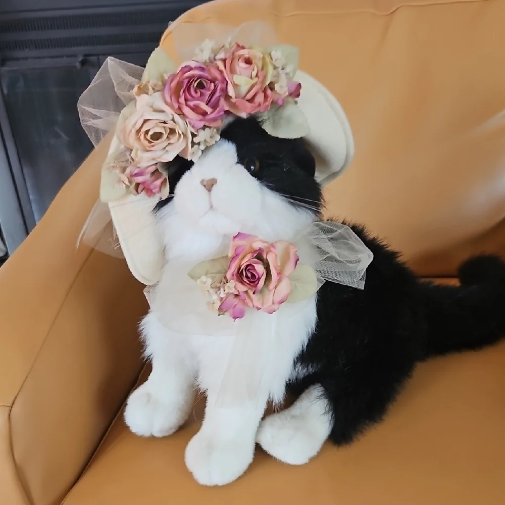 Black and White Plush Cat with flowered hat.